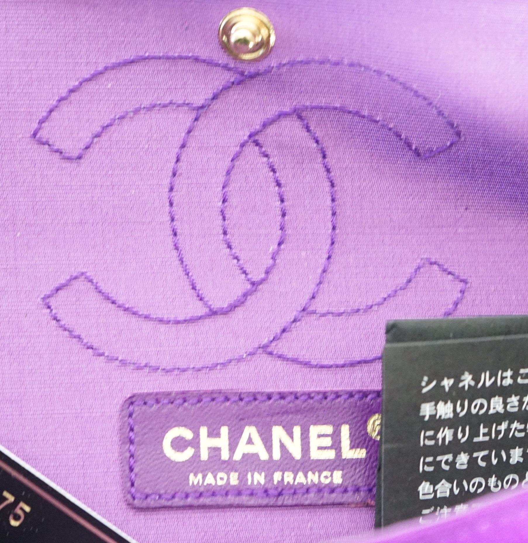 A Chanel medium-sized 2-55 bag in purple silk satin stitched with a quilted crocodile pattern, width 24cm, height 15cm, depth 6cm Single handle 112cm, Double handles 65cm